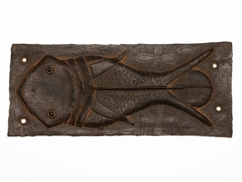Ama O Ghe Ehen (Fish Plaque), 18th Century, Brass(bronze), 43 x 18 cm. Court of the Oba of Benin, Nigeria. Courtesy of the NCMM, on behalf of the Oba of Benin. Photograph by Martijn Schmidt.